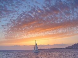 yacht on sea at colorful sunset, spain, lanzarote