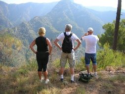 tourists on a high hill