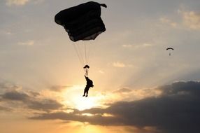 skydiver at sunset