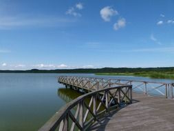 boardwalk with railing on lake, germany