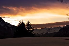 winter landscape against a colorful bright sunset