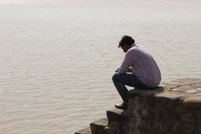 man on the shore of Lake Sukhna