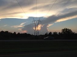 Stormy sky on the background of electric poles with wires