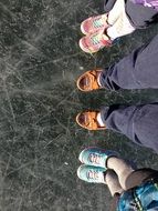 colorful shoes on frozen lake