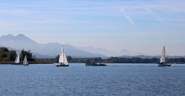 chiemsee blue lake with boats landscape