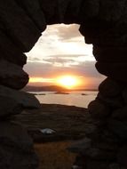 Beautiful and colorful sunset view through the cave on Titiicaca See in Peru