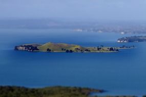 scenic island on sea at foggy evening, new zealand, auckland