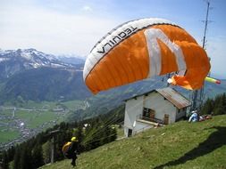 taking off paraglider in the picturesque mountains