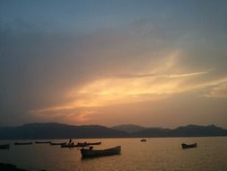 landscape of boats on the river during sunset