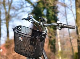 basket near the steering wheel on a bicycle