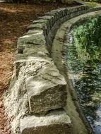 stone wall near the pond