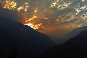 wildfire on mountain side at sunset