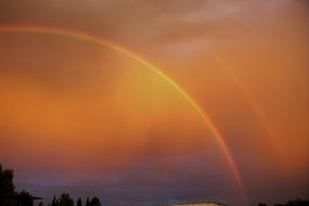 double rainbow in the bright sky