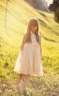 girl in white tender dress in the sunlight