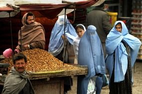 afghanistan women and man on market