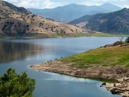 Beautiful hills with plants near a lake in California