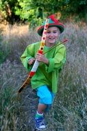 boy robin hood in the forest