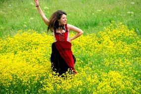 dancing cheerful young woman