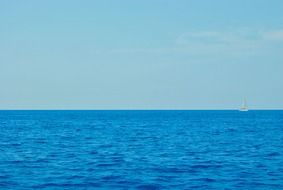 distant view of sailing yacht on sea