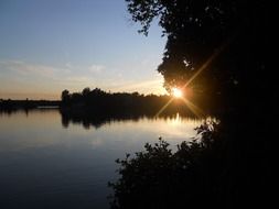 sunset over the lake in summer