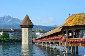 stone tower on river mountains view