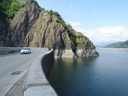 car on a dam road