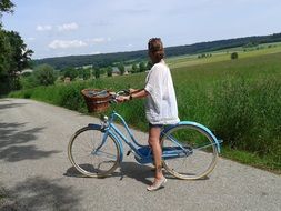 girl on the bike in the summer in Bavaria