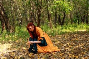 girl in princess dress in the autumn forest