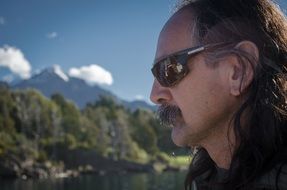 profile portrait of a man in sunglasses