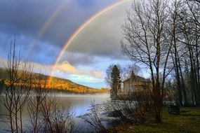 rainbow under lake landscape