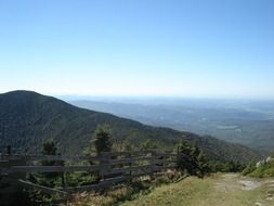 fence on the hiking path in the mountains