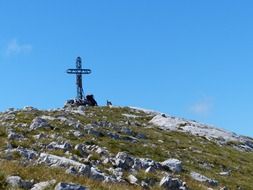 landscape of metal cross on the mountain summit