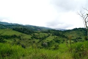 panoramic view of green hills in costa rica