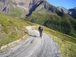 tourist on a bicycle in the zillertal valley