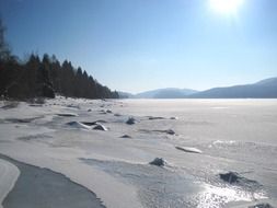 Landscape with the frozen lake in winter