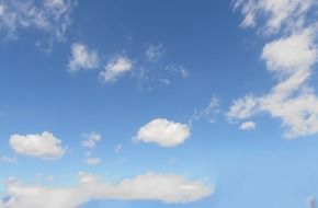 white clouds in the sky in spring