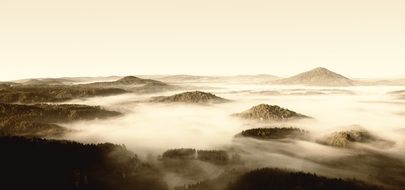 mountains in fog in czech-saxon switzerland