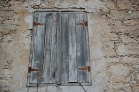 wooden window on a stone building