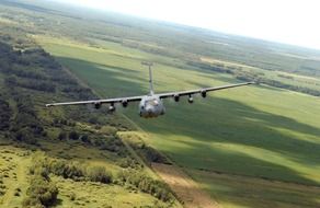 aircraft c-130 over the field, Minnesota