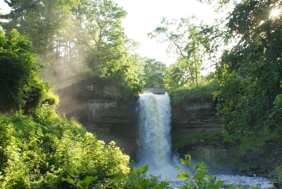 Landscape with the beautiful waterfall in the forest