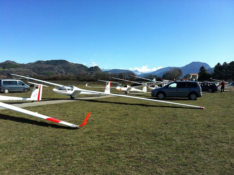 Parked gliders on meadow
