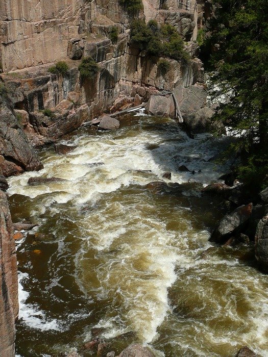 carrying water of the river near the rock