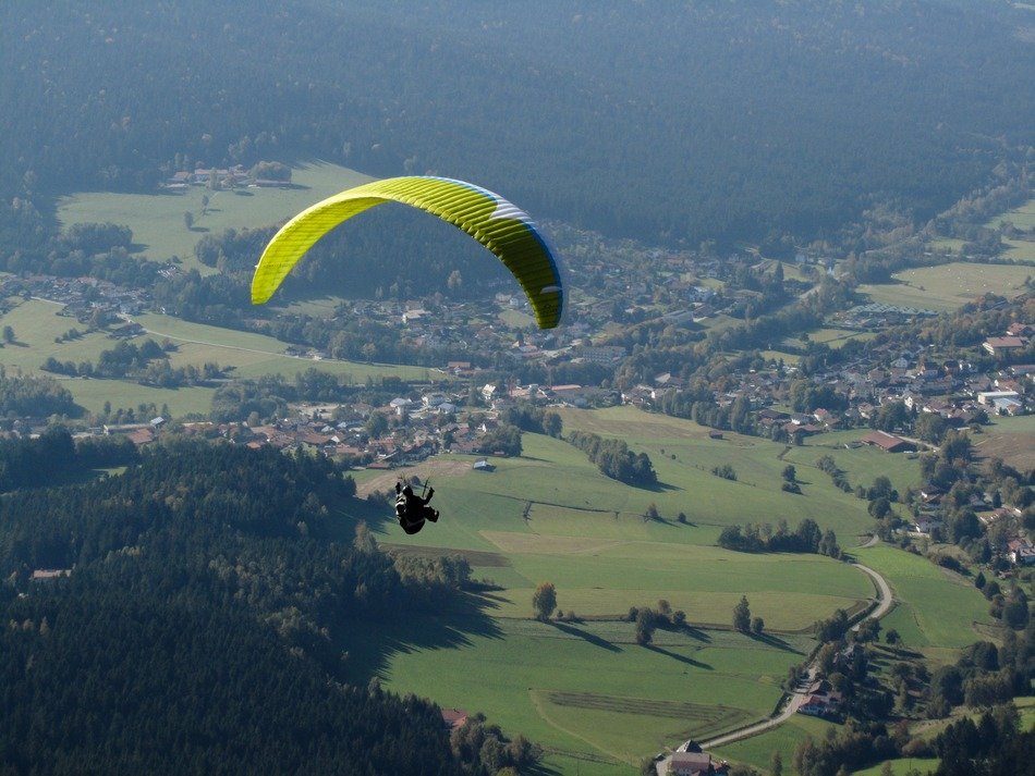 paragliding over the green valley