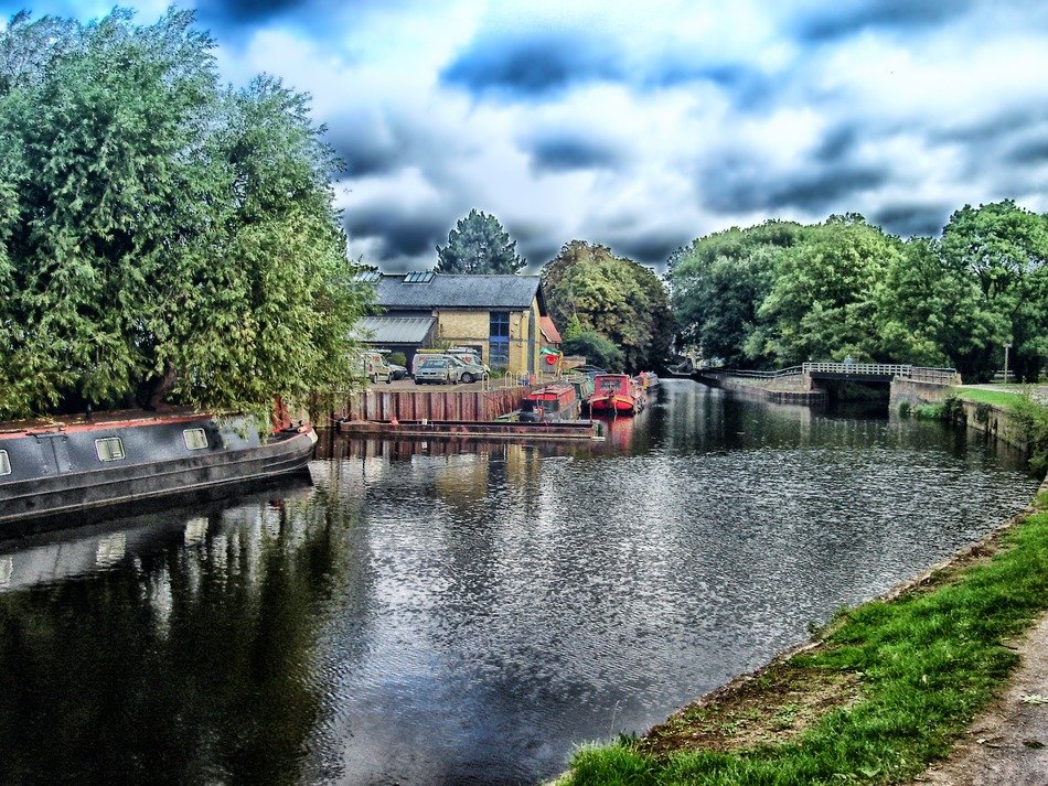 canal with floating houses in England