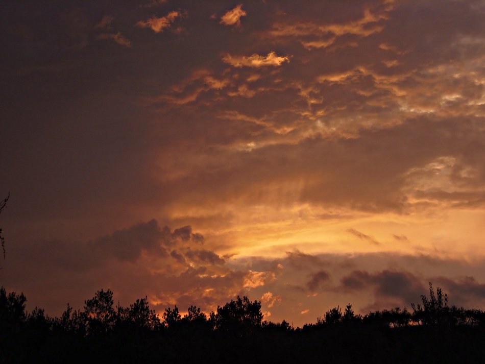 sunset behind the clouds