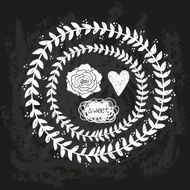 vector chalk doodle sketch of wreath on blackboard