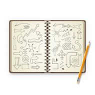 Pencil and open notebook with painted arrows