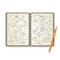 Pencil and open notebook with painted arrows