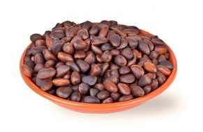 seeds of pine in a brown bowl