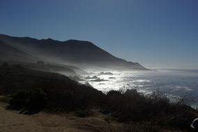 mist over scenic coast at dusk